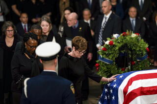 A line of mourners near the casket of former President Carter