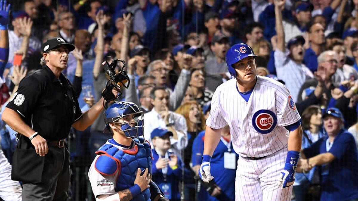 Cubs pinch-hitter Miguel Montero watches his grand slam head toward the right-field bleachers in the eighth inning of the NLCS opener on Saturday at Wrigley Field.