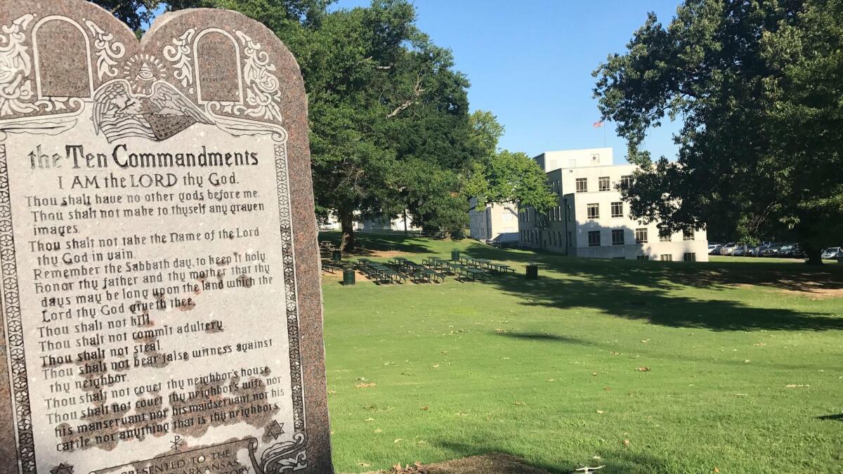A monument engraved with the Ten Commandments was erected outside the Arkansas state Capitol Tuesday. Less than 24 hours later, a man slammed his car into the granite slab.