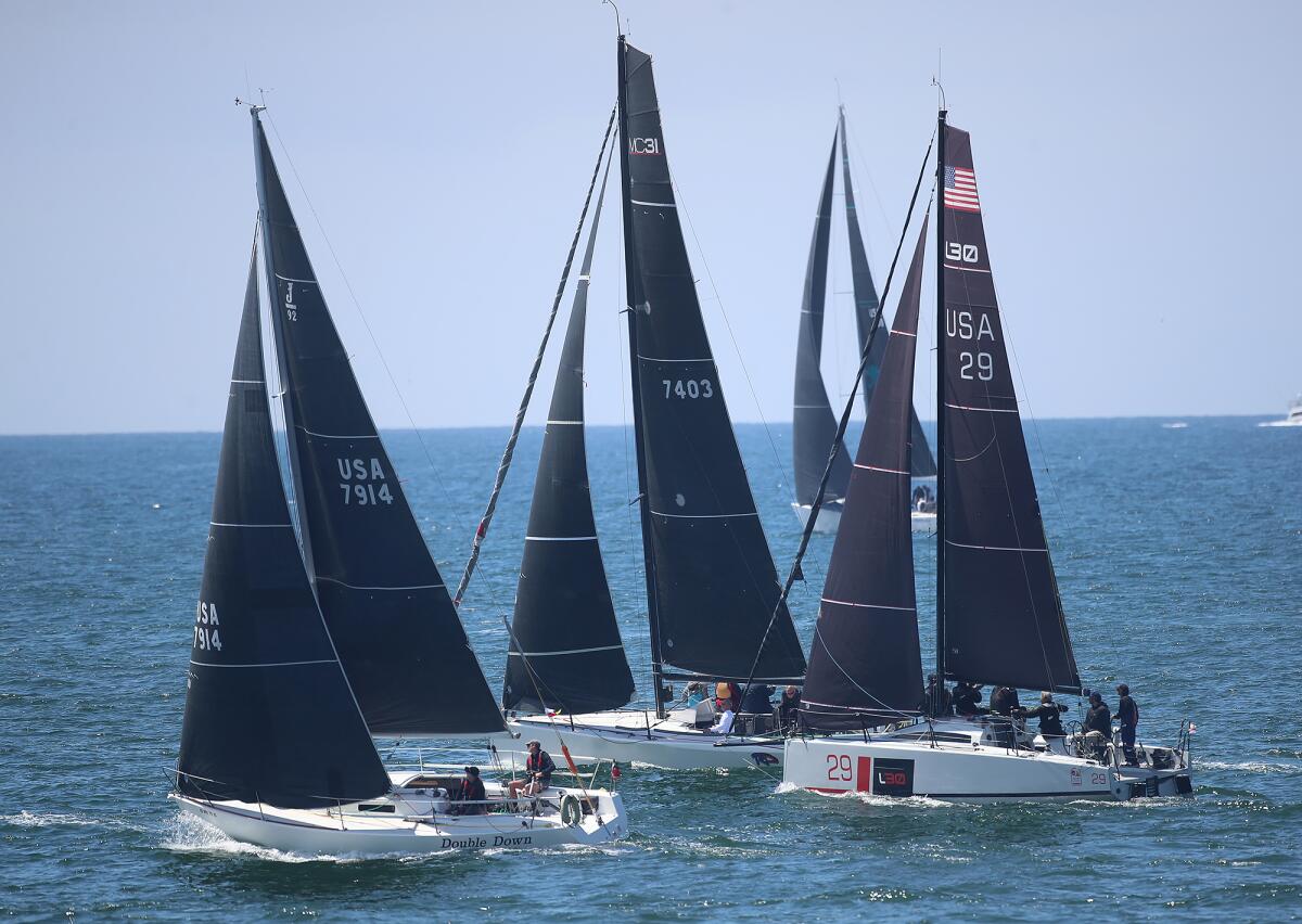 Three racers including crews on Double Down, Radical Departure and Dart.