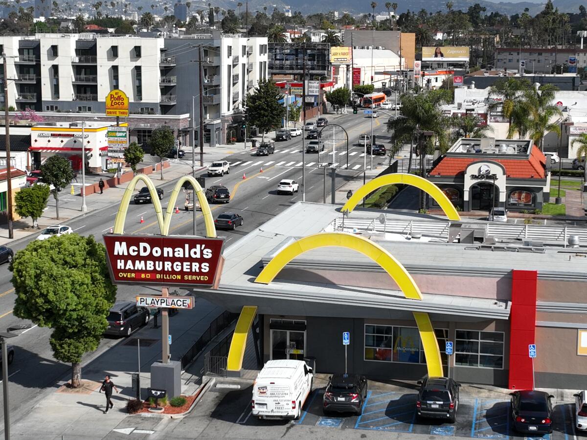 An aerial view of fast food restaurants on Crenshaw Boulevard including Taco Bell, McDonald's, and El Pollo Loco. 
