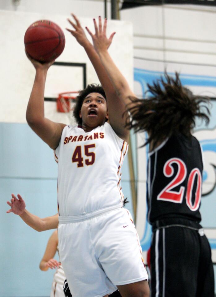La Cañada High's Zoe Williams takes a shot from the paint in a game against Glendale High at Arroyo High School in El Monte on Friday, Dec. 18, 2015.