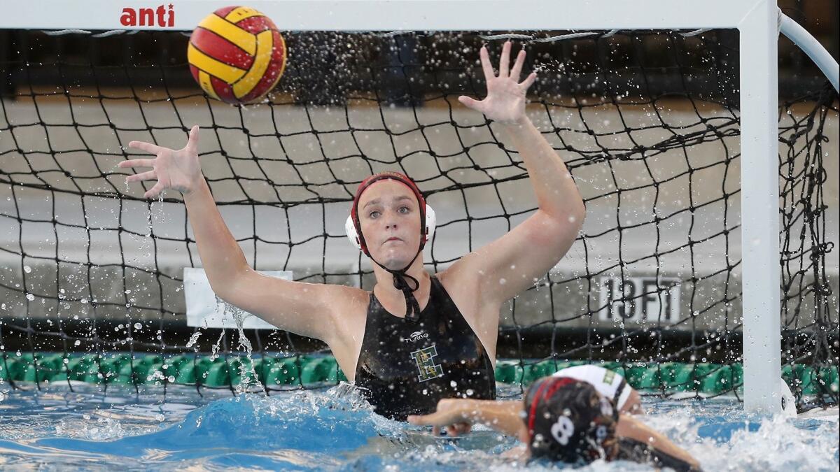 Edison High goalkeeper Coryn Cavecche defends the net in the first half of the CIF Southern Section Division 4 first-round playoff match at Troy on Tuesday.
