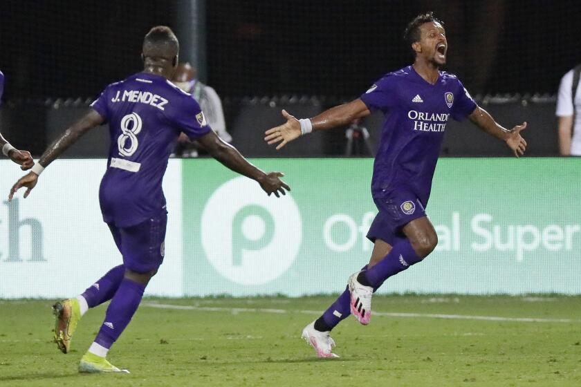 Orlando City's Nani, right, celebrates with Jhegson Medez after scoring against Inter Miami during the second half of an MLS soccer match Wednesday, July 8, 2020, in Kissimmee, Fla. (AP Photo/John Raoux)