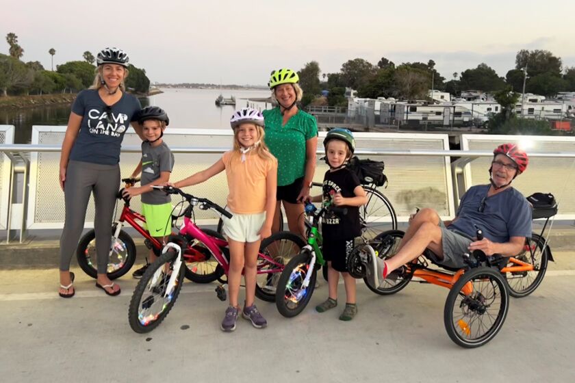 Three generations of the Van Clief family while biking over the bridge between Campland and Mission Bay RV Park.