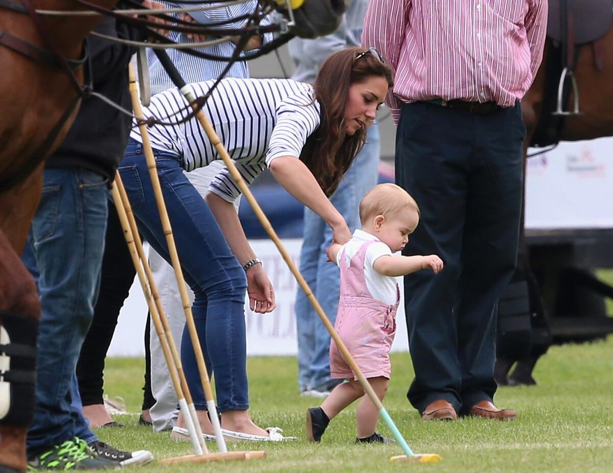 Catherine, Duchess of Cambridge, and Prince George of Cambridge attend the Royal Charity Polo match during the Maserati Jerudong Trophy at Cirencester Park Polo Club.