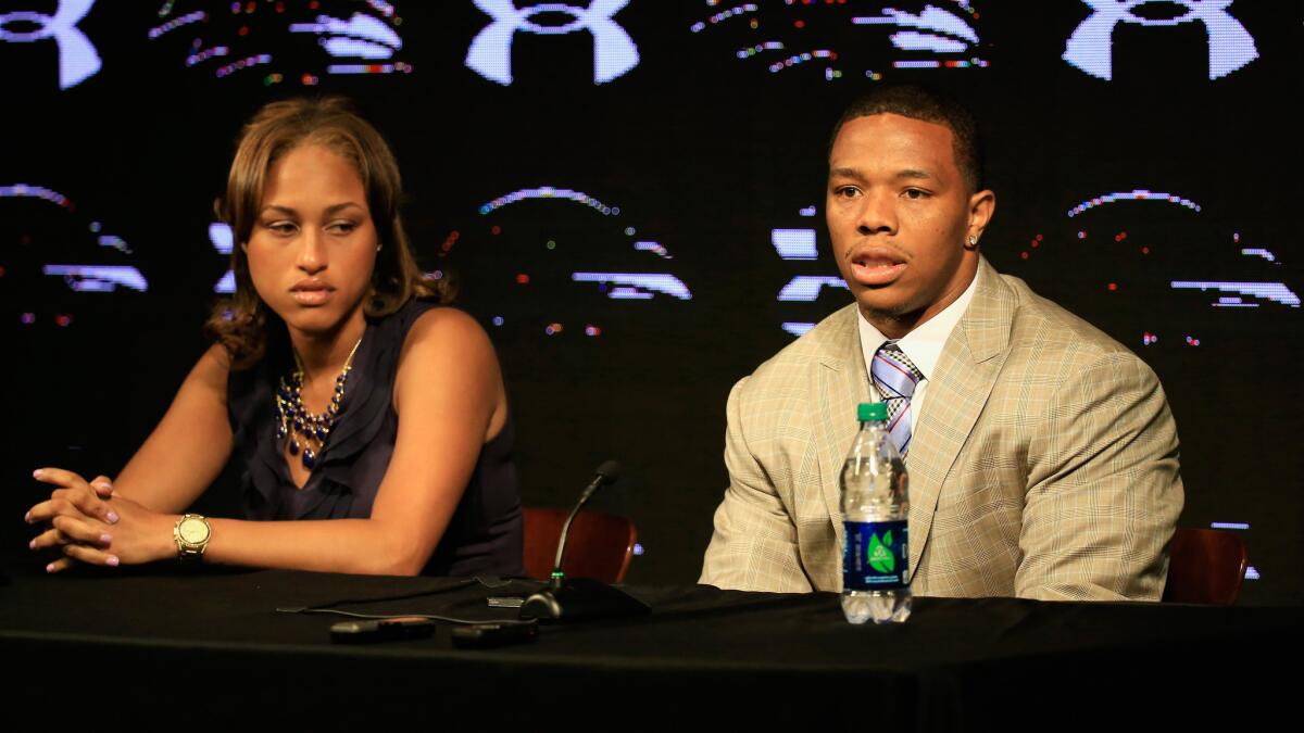 Baltimore Ravens running back Ray Rice sits next to his wife, Janay, during a news conference in May. Ray Rice was cut by the Ravens and suspended indefinitely by the NFL on Monday.