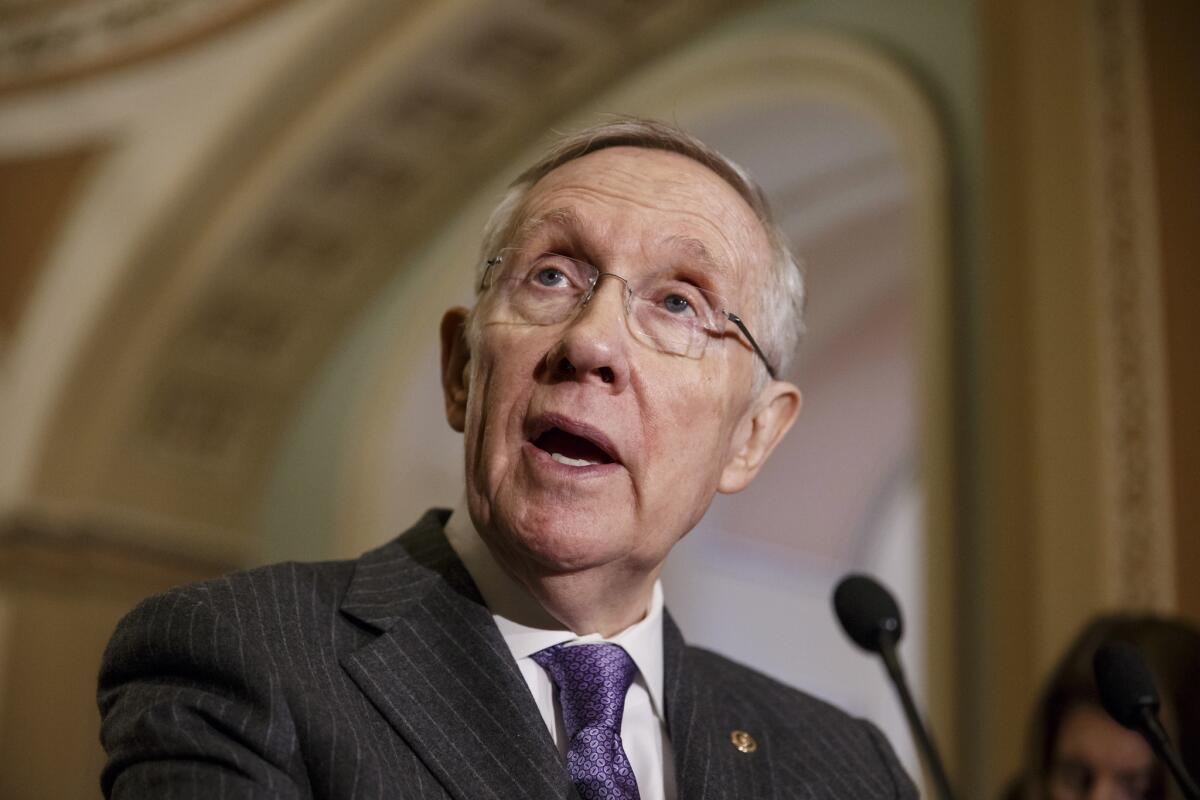 Senate Majority Leader Harry Reid of Nevada talks to reporters Tuesday on Capitol Hill.