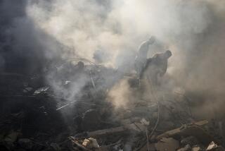 Rescue workers search for victims at the site of Thursday's Israeli airstrike in Beirut, Lebanon, Friday, Oct. 11, 2024. (AP Photo/Hassan Ammar)