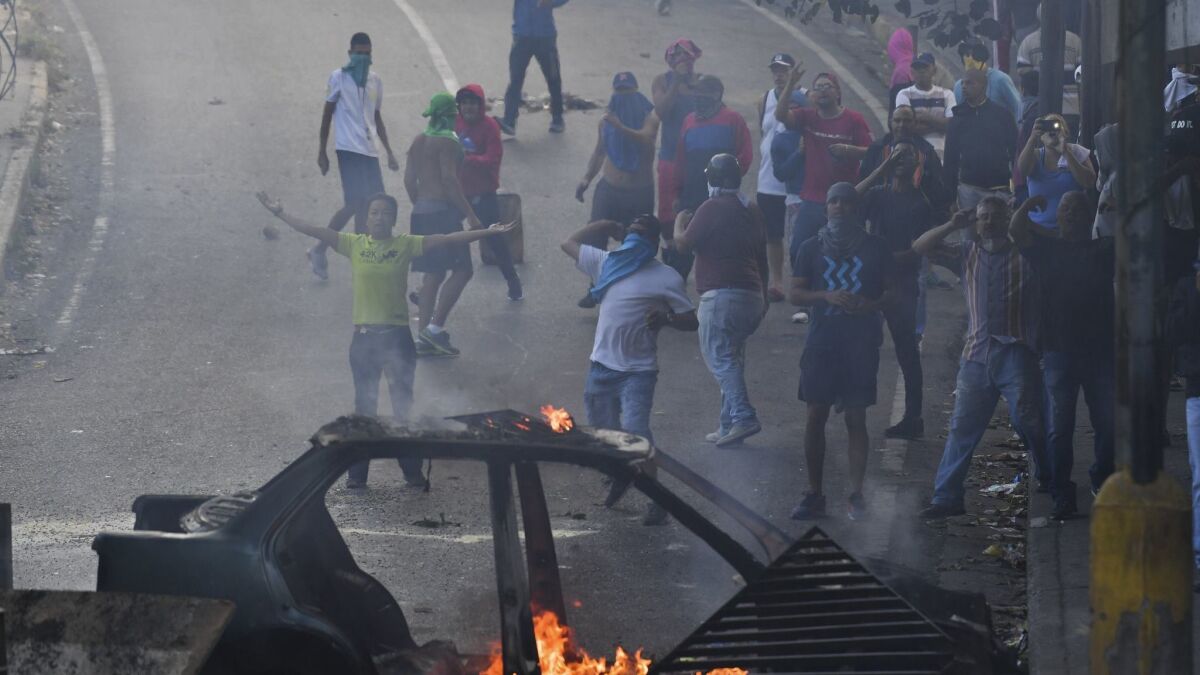 People protest around the national guard headquarters in Caracas, Venezuela, on Jan. 21, 2019.