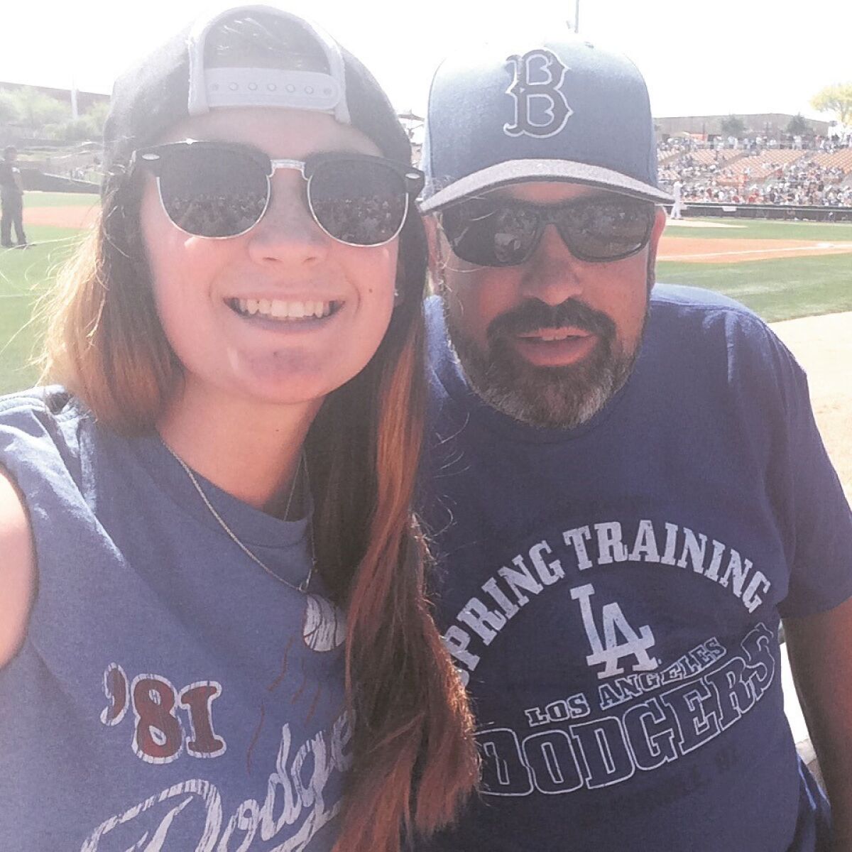 Michael Lennon with his daugther, Emily Lennon, catching the Dodgers' last spring training game in Arizona this past March.