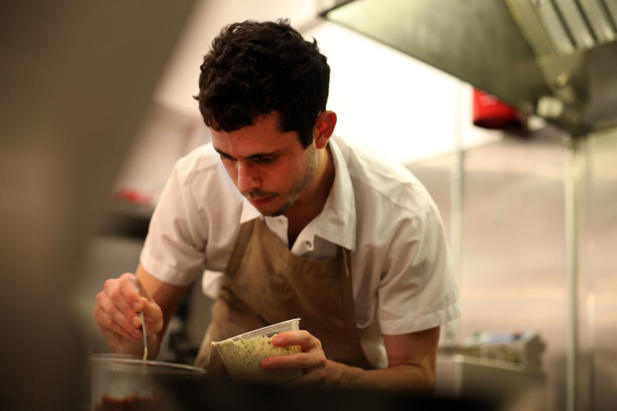 Chef Ari Taymor is shown in 2012, when he opened his downtown Los Angeles restaurant, Alma, with partner Ashleigh Parsons. The two have just announced the restaurant will close later this month.