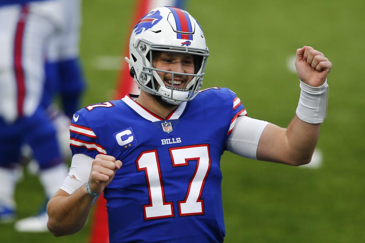 Buffalo Bills quarterback Josh Allen celebrates after throwing a touchdown pass.