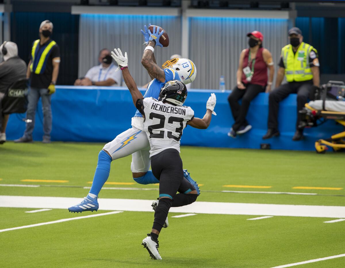 Chargers wide receiver Keenan Allen hauls in a pass over Jacksonville Jaguars cornerback CJ Henderson.