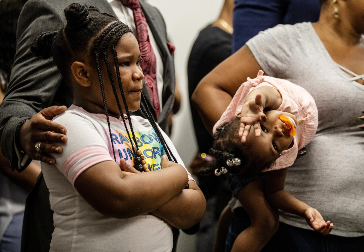 Blessen Miller, 8, left, and her sister, Memory, at a news conference about Rayshard Brooks in Atlanta.