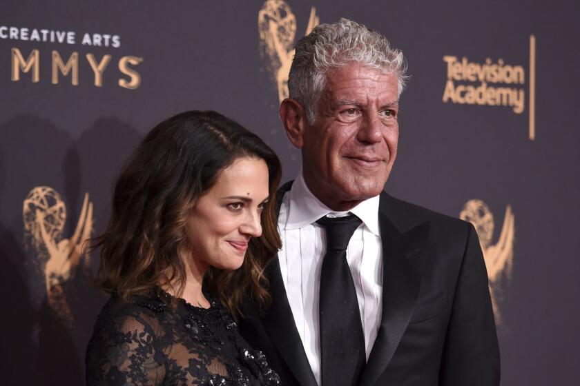 Asia Argento, left, and Anthony Bourdain arrives at night one of the Creative Arts Emmy Awards at the Microsoft Theater on Saturday, Sept. 9, 2017, in Los Angeles. (Photo by Richard Shotwell/Invision/AP)