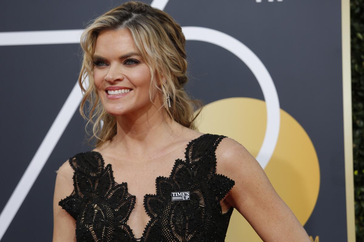 Missi Pyle wearing a Time's Up pin as she arrives at the 75th Golden Globes at the Beverly Hilton Hotel in January.