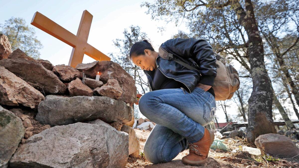 A friend of Isidro Baldenegro Lopez visits his grave site in January. Baldenegro was the fifth environmental defender killed in the last year in the community of Coloradas de la Virgen, Chihuahua, in the Golden Triangle.