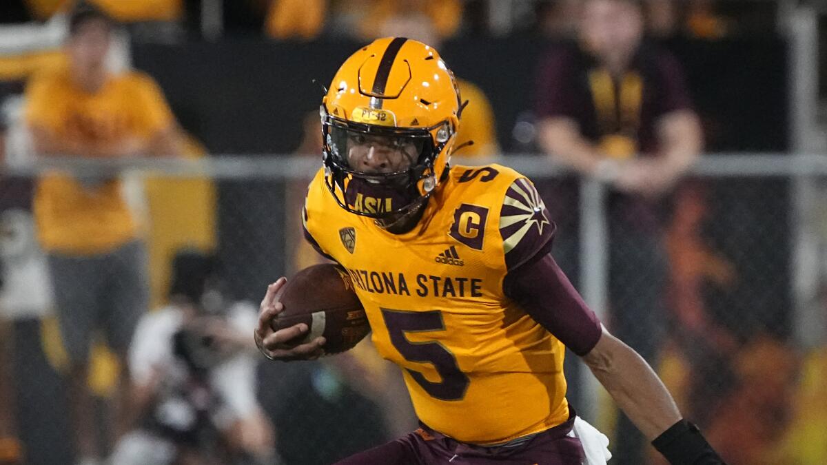 Arizona State quarterback Jayden Daniels carries the ball against Colorado on Sept. 25.