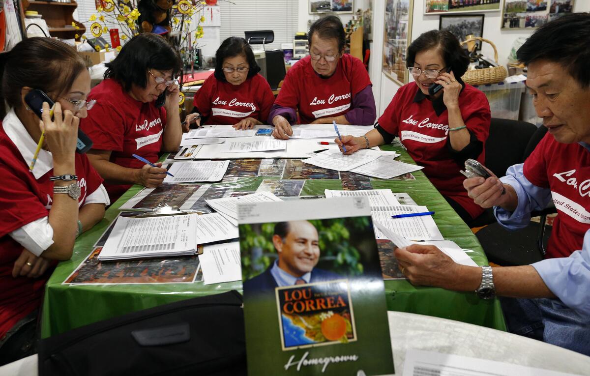 Vietnamese American volunteers in Garden Grove work a phone bank calling on Orange County voters to support their candidate, Democrat Lou Correa, for Congress.