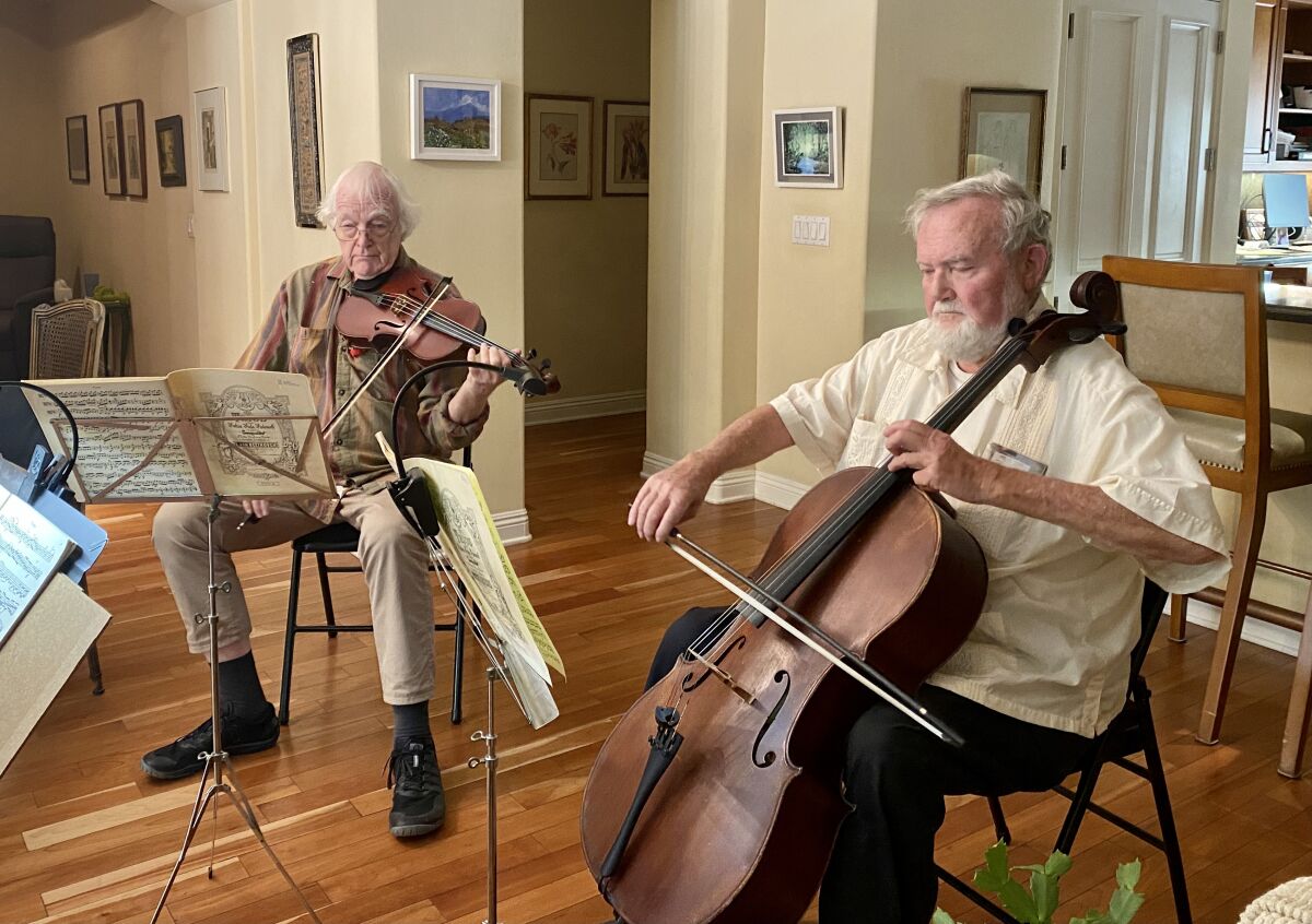 Jack Clausen (left) and Willis Frisch have played music together for more than 50 years.
