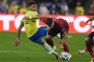 Brazil's Lucas Paqueta, left, and Costa Rica's Julio Cascante battle for the ball.