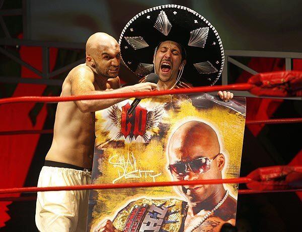 Usman Ally, left, and Desmin Borges in "The Elaborate Entrance of Chad Deity" at the Geffen Playhouse through Oct. 9. The satirical play is set in the wacky world of professional wrestling.