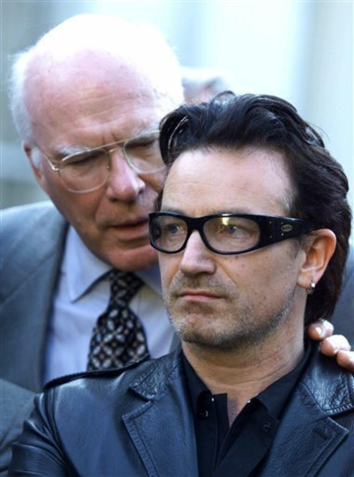 FILE - This is a Oct. 2, 2000 file photo of Senator Patrick Leahy D-Vt., left, as he talks to Bono a musician from the group U2 during a news conferece at the White House in Washington. (AP Photo/Joe Marquette, File)