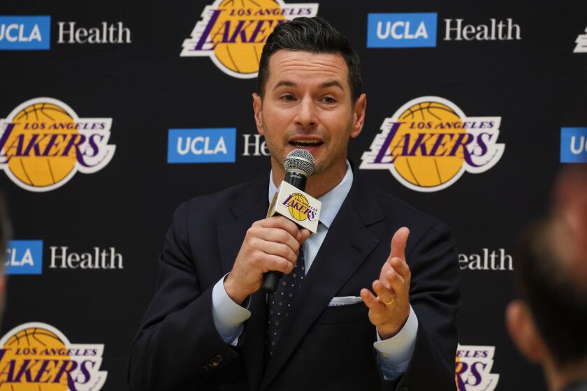 Lakers coach JJ Redick fields questions during his introductory news conference.