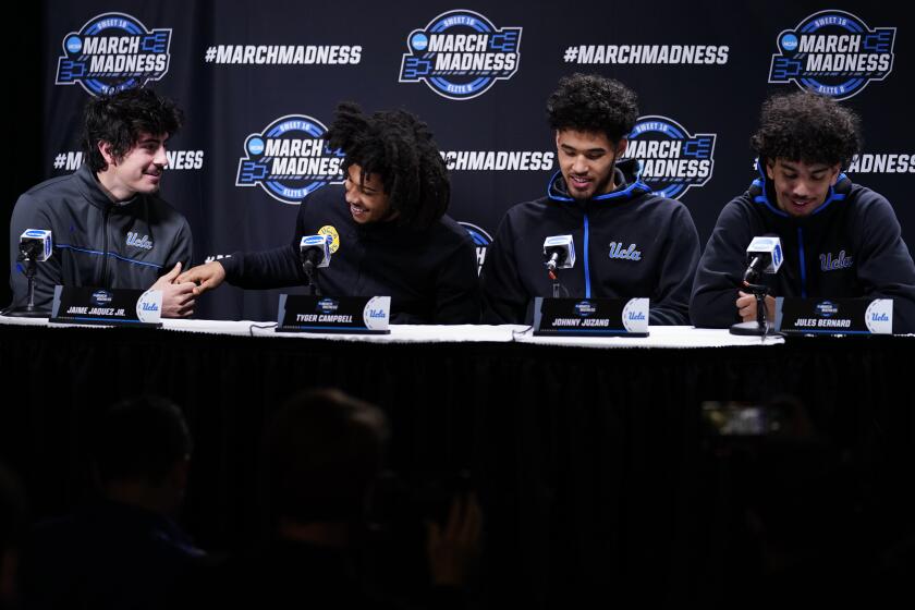 UCLA's Jaime Jaquez Jr., from, left, Tyger Campbell, Johnny Juzang and Jules Bernard react during a news conference for the NCAA men's college basketball tournament, Thursday, March 24, 2022, in Philadelphia. (AP Photo/Matt Rourke)