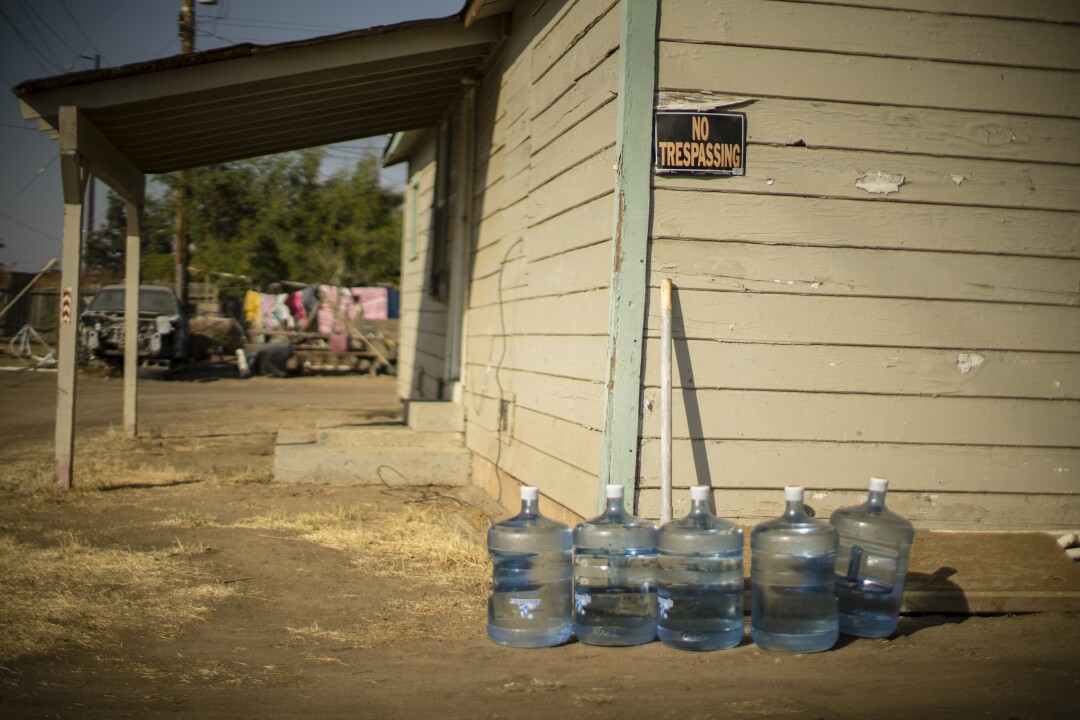 A drinking water allotment is given to residents of Tooleville, California. 