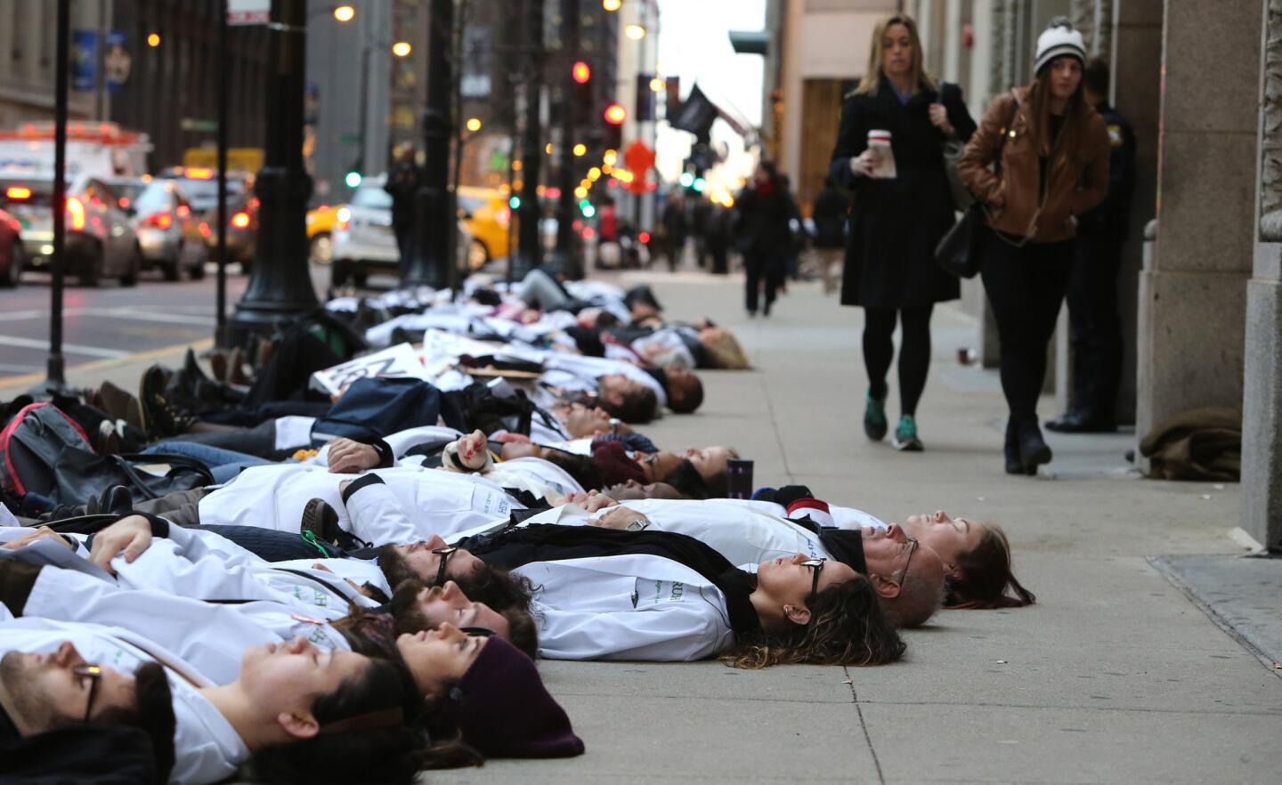 Protesters stage a die-in outside City Hall in the Loop on Dec. 10, 2015. Activists were calling for the resignation of Mayor Rahm Emanuel.