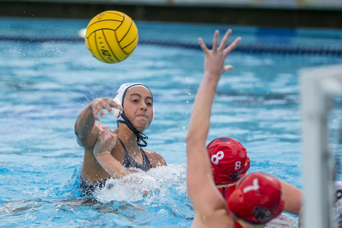 Newport Harbor's Sophia Del Villar takes a shot under pressure from San Marcos' Makenna Stretz (8) during Thursday's match.