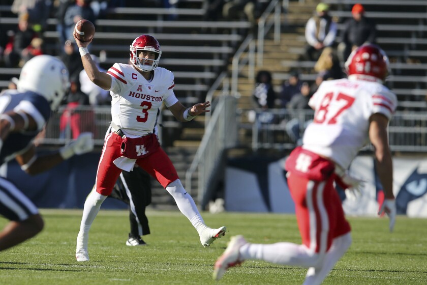 Houston quarterback Clayton Tune (3) throws a pass to Houston wide receiver Jake Herslow (87) during the first half of an NCAA football game against Connecticut, Saturday, Nov. 27, 2021, in East Hartford, Conn. (AP Photo/Stew Milne)