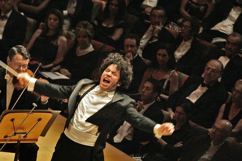 Ho, Lawrence K. Ã±Ã± Ã± LOS ANGELES, CA. OCT. 8, 2009. Gustavo Dudamel conducting the LA Phil for the first time as Music Director in the Inaugural Gala and Opening Night Concert at Walt Disney Concert Hall on Oct. 8, 2009. (Lawrence K. Ho/Los Angeles Times)