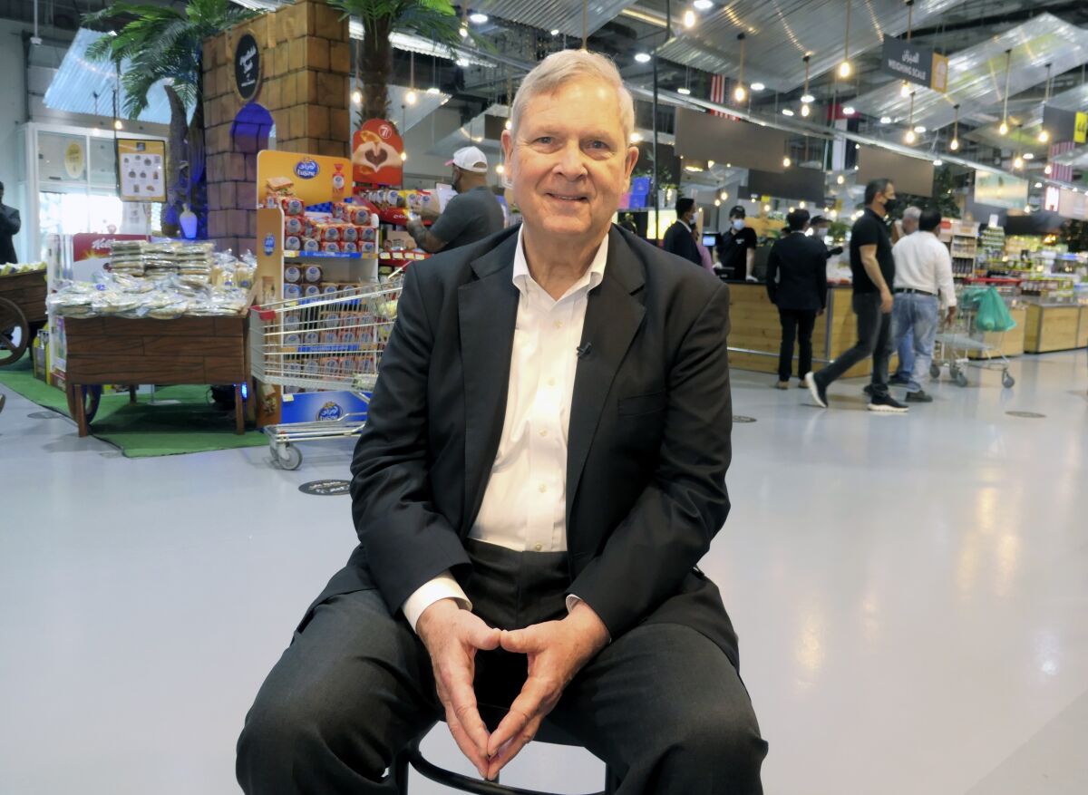 U.S. Secretary of Agriculture Tom Vilsack poses for a photo at the Fruit and Vegetable Market in Dubai, United Arab Emirates, Saturday, Feb. 19, 2022. A possible Russian invasion of Ukraine that threatens to cut off agricultural exports from the global grains powerhouse offers American farmers a chance to boost production and prevent supply chain problems, the U.S. secretary of agriculture said Saturday. (AP Photo/Isabel DeBre)