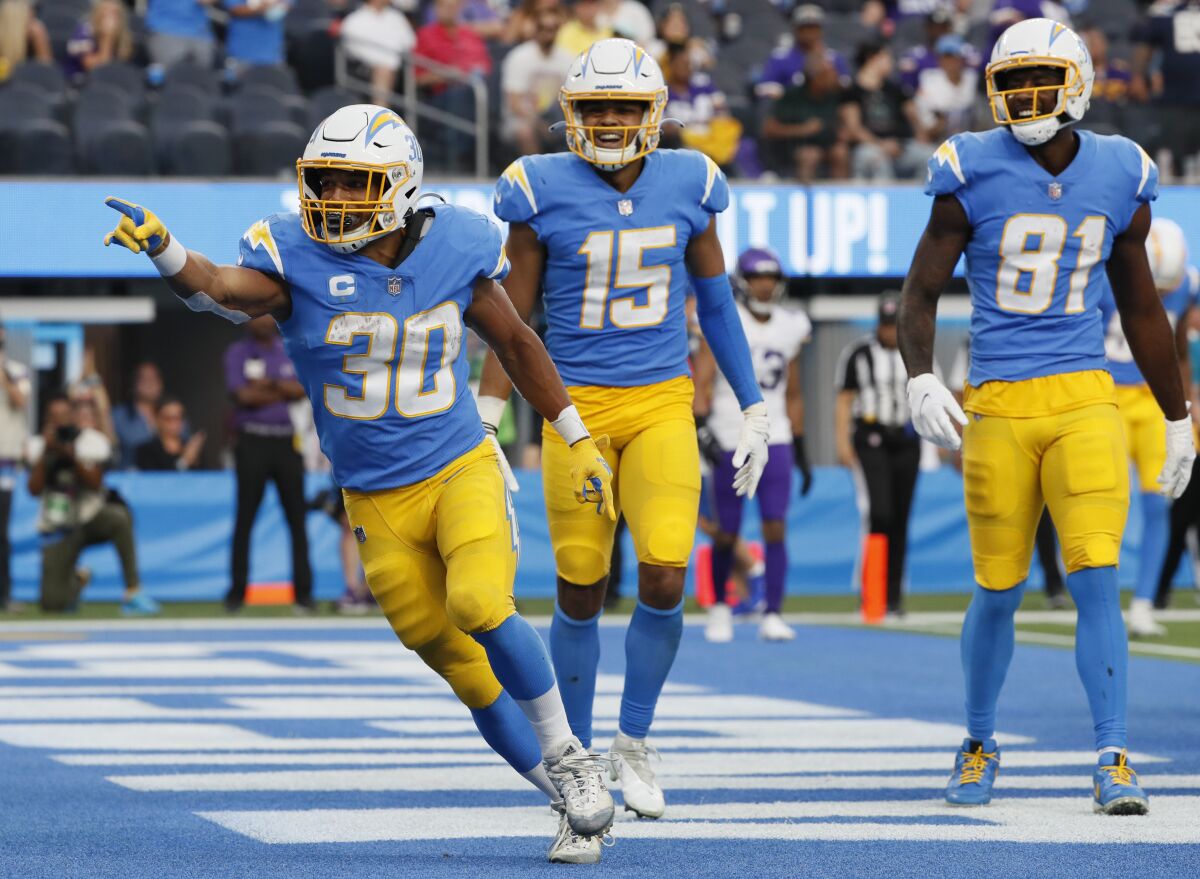 Chargers running back Austin Ekeler (30) celebrates after scoring a touchdown against the Minnesota Vikings on Nov. 14.