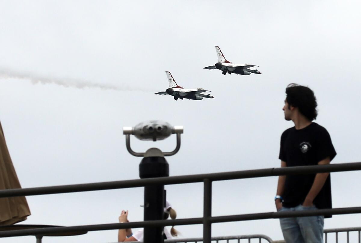 U.S. Air Force jets do a high speed pass over the Huntington Beach Pier Friday as the Pacific Airshow begins a three-day run.