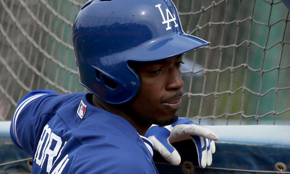Dodgers infielder Dee Gordon takes part in batting practice at the team's spring-training facility in Glendale, Ariz., on Feb. 25. Gordon drove in a pair of runs in Monday's 7-3 Cactus League loss to the Oakland Athletics.