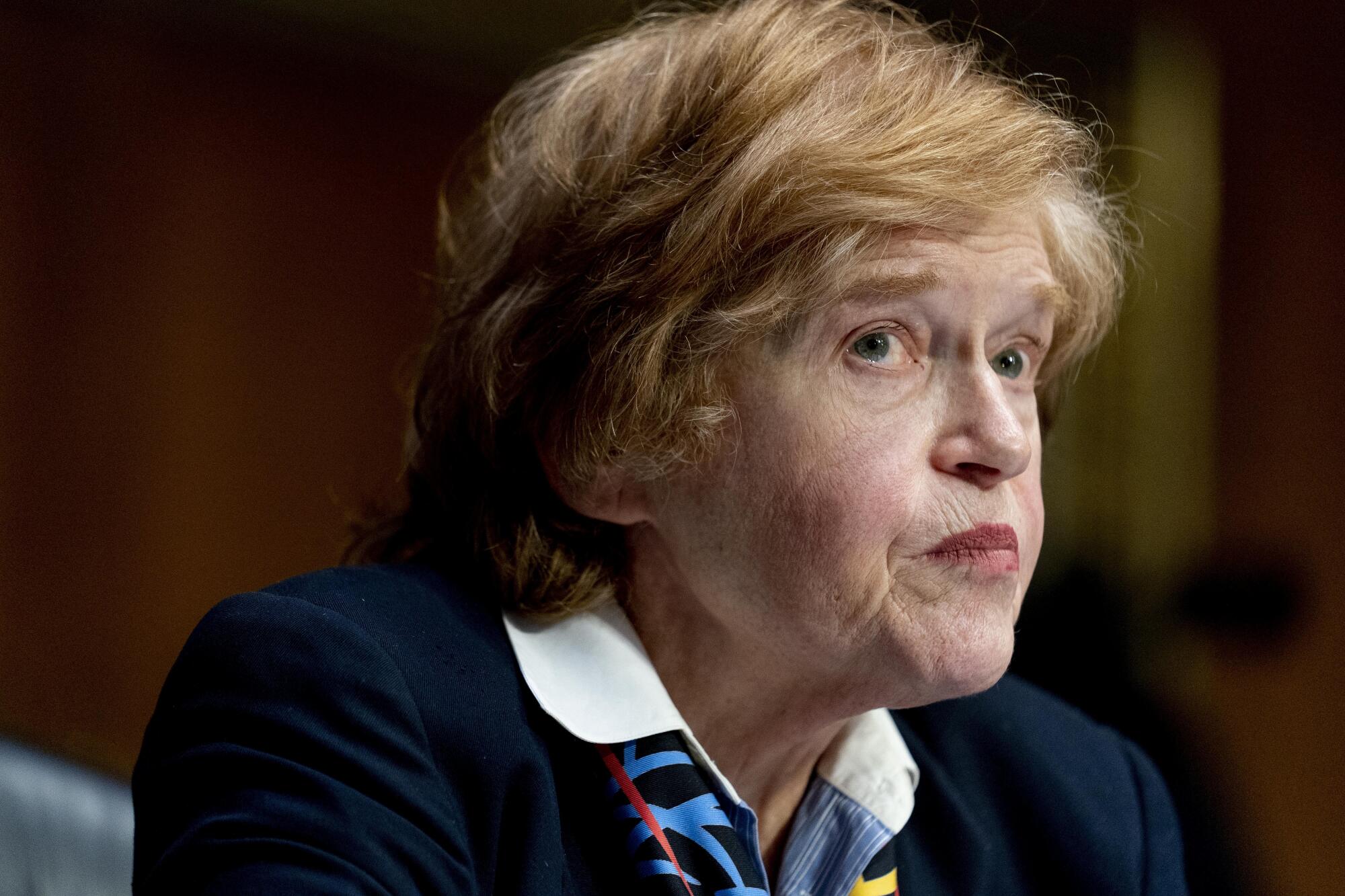 Deborah Lipstadt seated in three-quarter profile with a blazer and collared shirt