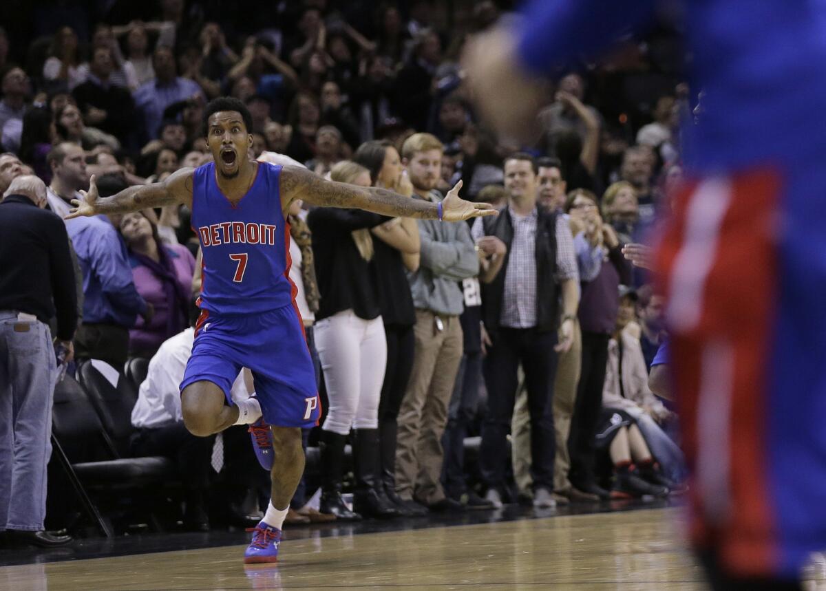 Pistons guard Brandon Jennings celebrates after hitting the game-winning shot to give Detroit a 105-104 victory over the San Antonio Spurs.