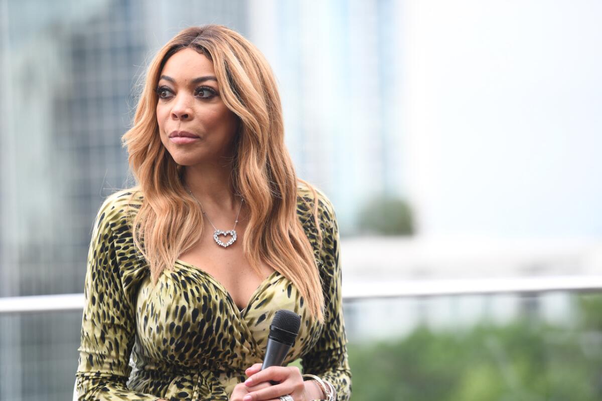 Wendy Williams holding a microphone