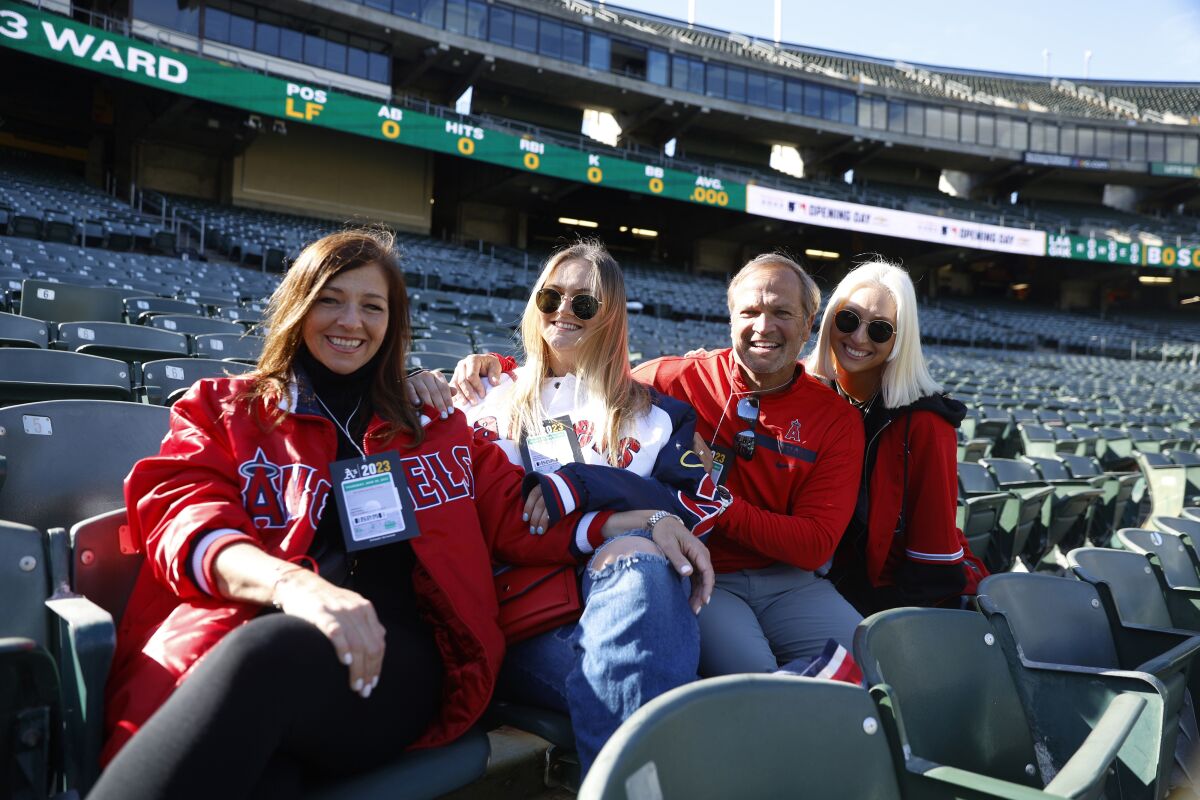 Family and friends of Los Angeles Angels catcher Logan O'Hoppe, from left, Angela O'Hoppe, Mel O'Hoppe, Michael O'Hoppe and Jill Mulitz pose for a photo prior to an opening day baseball game between the Angels and the Oakland Athletics in Oakland, Calif., Thursday, March 30, 2023. (AP Photo/Jed Jacobsohn)