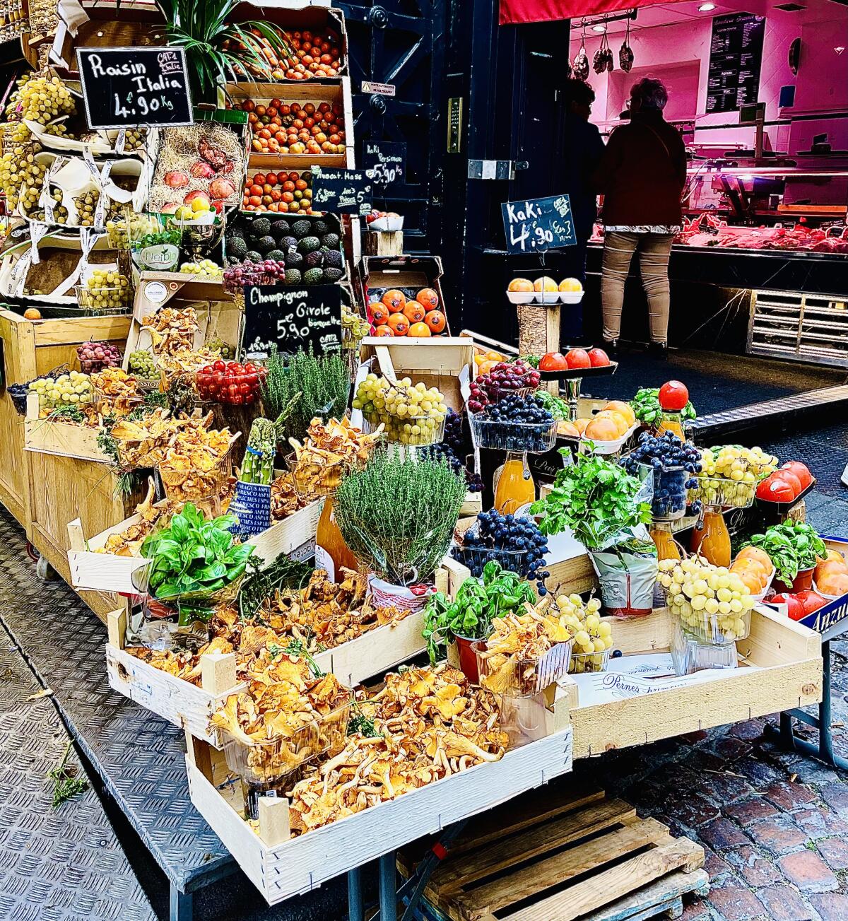 Mushrooms, fruit and more produce at a vendor along the Paris market street Rue Mouffetard.