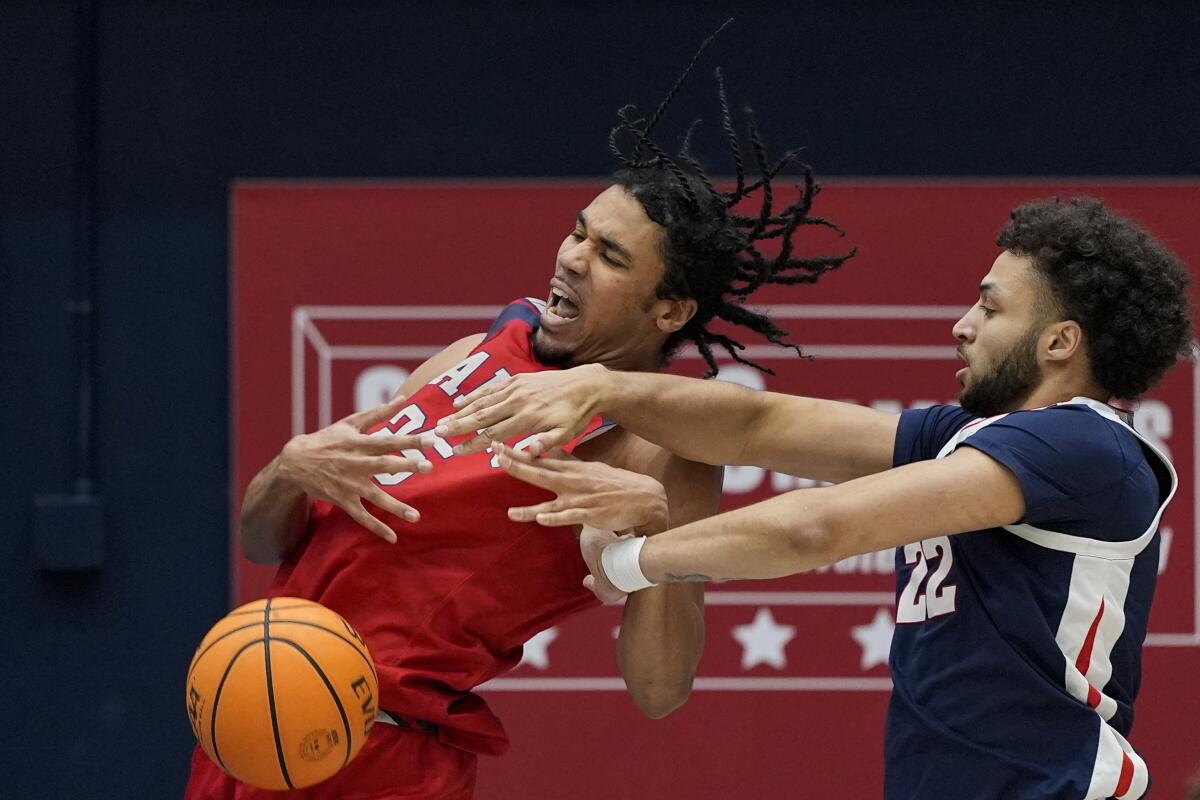 Saint Mary's forward Mason Forbes, left, battles Gonzaga forward Anton Watson for the ball during a game on March 2.