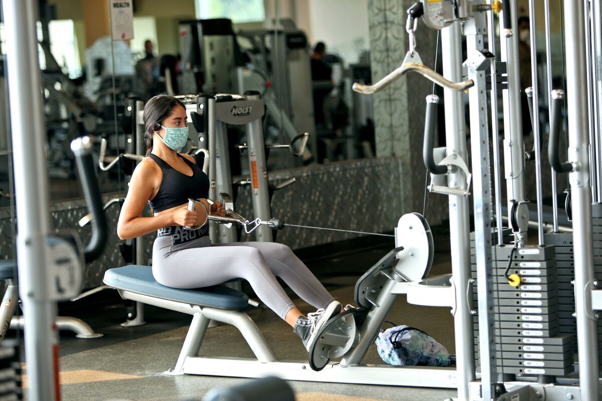 A woman works out in a gym