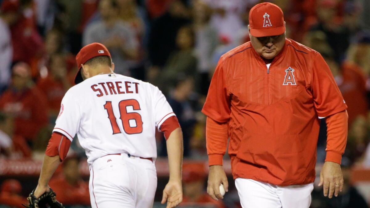 Angels closer Huston Street is removed from the game against the Indians by Manager Mike Scioscia in the ninth inning Saturday night.