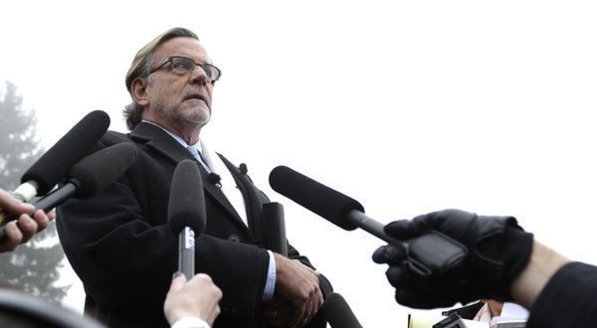 John Henry Browne, a civilian attorney for U.S. Army Staff Sgt. Robert Bales, talks to reporters after Bales' arraignment at Joint Base Lewis McChord in Washington state.