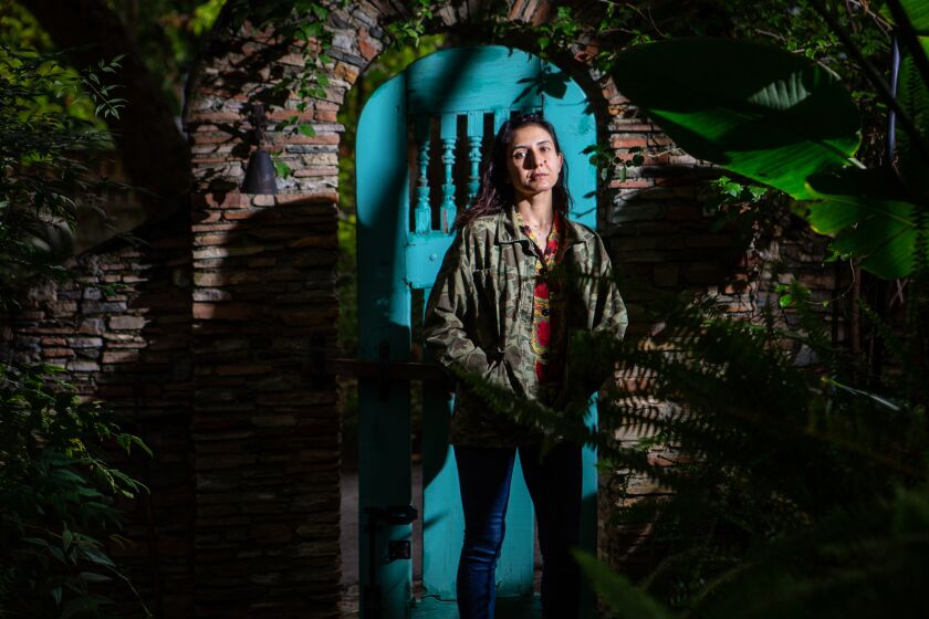 PASADENA, CA - MAY 18: Author, Ottessa Moshfegh poses for a portrait in the lush gardens surrounding her home at the base of the Angeles National Forest during the coronavirus pandemic on Monday, May 18, 2020 in Pasadena, CA. Moshfegh who's new highly anticipated book "Death in Her Hands" is a a novel of haunting metaphysical suspense about an elderly widow whose life is upturned when she finds an ominous note on a walk in the woods. (Jason Armond / Los Angeles Times)