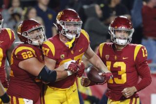 LOS ANGELES, CA - NOVEMBER 5, 2022: USC Trojans tight end Lake McRee (87) is congratulated by USC Trojans.